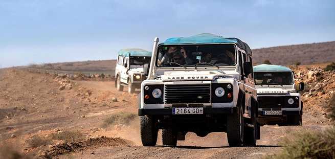 Caravan of vehicles on a Jeep Safari excursion in Lanzarote